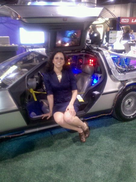 RelWare representative Rhonda Herron gives an example of the photo opportunities available at our HIMSS booth with the famous time-travelling Delorean